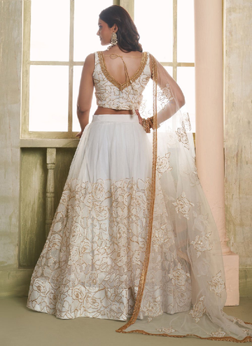 Classic cream colored Net lehenga with zari, thread sequin work
